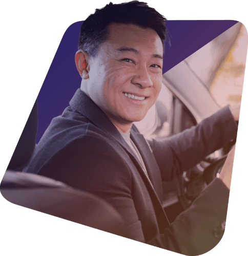 A Bonvia driver at the wheel on the ground leg of a treatment trip.